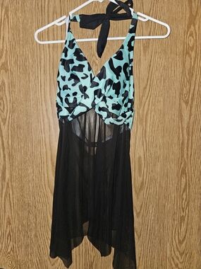 Halter-neck swimsuit dress featuring a teal cow print bus